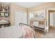 Charming bedroom with a gold metal crib, and soft decor, creating a peaceful and inviting space at 551 Hemmings Nw Pl, Concord, NC 28027