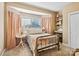 Cozy bedroom with bay window, a brass bed frame, and decorative accents creating a warm, inviting space at 551 Hemmings Nw Pl, Concord, NC 28027
