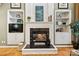 Stylish living room featuring built-in shelving, a marble fireplace, and comfortable seating for relaxation and entertainment at 551 Hemmings Nw Pl, Concord, NC 28027