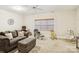 Comfortable living room with a sofa, cozy seating area, and a large window providing ample natural light at 551 Hemmings Nw Pl, Concord, NC 28027
