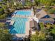 Aerial view of an expansive community pool and clubhouse with ample seating and landscaped areas at 551 Hemmings Nw Pl, Concord, NC 28027
