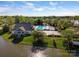 Aerial view of a community pool with a clubhouse and a lake highlighting recreational amenities at 551 Hemmings Nw Pl, Concord, NC 28027