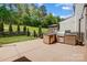 Backyard with built in grill, countertop, and well manicured lawn at 5628 Selkirkshire Rd, Charlotte, NC 28278