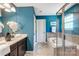 Bright bathroom featuring a double sink vanity, soaking tub, and separate glass enclosed shower at 5628 Selkirkshire Rd, Charlotte, NC 28278
