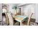 Dining room showcasing a wooden table with six seats, complemented by elegant decor and hardwood flooring at 5628 Selkirkshire Rd, Charlotte, NC 28278