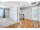 Bright upstairs hallway showcasing wood flooring and access to bedrooms at 5628 Selkirkshire Rd, Charlotte, NC 28278