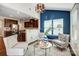 Open concept living room adjacent to the kitchen with cozy seating at 5628 Selkirkshire Rd, Charlotte, NC 28278
