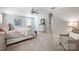 Serene main bedroom featuring neutral tones, carpet flooring, and a cozy sitting area at 5628 Selkirkshire Rd, Charlotte, NC 28278