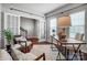 Well-lit office featuring a desk, two chairs, hardwood flooring, and French doors at 5628 Selkirkshire Rd, Charlotte, NC 28278