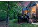View of the deck on the back of the home overlooking the backyard with trees at 6017 Summerston Pl, Charlotte, NC 28277
