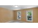 This bedroom features two windows that provide natural light and a neutral color scheme that create a relaxing atmosphere at 6017 Summerston Pl, Charlotte, NC 28277