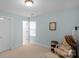 Serene bedroom with natural light, neutral walls, and a comfortable seating area, creating a peaceful retreat at 6017 Summerston Pl, Charlotte, NC 28277