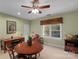 Bonus room with a wooden desk, a round wooden table and a ceiling fan at 6017 Summerston Pl, Charlotte, NC 28277