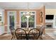 The formal dining area offers views of the backyard, a decorative light fixture, and access to the living room at 6017 Summerston Pl, Charlotte, NC 28277