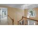 Bright foyer with hardwood floors and a large window above the front door at 6017 Summerston Pl, Charlotte, NC 28277