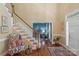 Inviting foyer with staircase, hardwood floors, and elegant decor at 6017 Summerston Pl, Charlotte, NC 28277