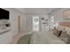 This bright main bedroom features a serene en-suite bath, built in storage, and a neutral color palette for a relaxing retreat at 6017 Summerston Pl, Charlotte, NC 28277