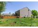 Expansive backyard featuring a well-maintained lawn and a classic wooden fence at 602 Black Maple Dr, Kannapolis, NC 28081