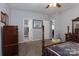Bedroom with a four-poster bed, neutral walls, and two open doorways to the bathroom and other rooms at 602 Black Maple Dr, Kannapolis, NC 28081