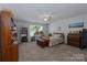 Bedroom featuring a bed with a patterned quilt, a window with plants, and ample storage at 602 Black Maple Dr, Kannapolis, NC 28081