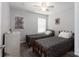Bedroom featuring two twin beds with matching bedding, neutral walls, and natural light at 602 Black Maple Dr, Kannapolis, NC 28081