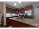 The kitchen is equipped with granite countertops and stainless steel appliances at 602 Black Maple Dr, Kannapolis, NC 28081