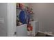 Functional laundry room with appliances, storage shelving, and space for sorting and folding at 602 Black Maple Dr, Kannapolis, NC 28081