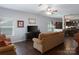 The living room has hardwood floors and access to the kitchen and dining areas at 602 Black Maple Dr, Kannapolis, NC 28081
