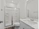 Clean, bright bathroom featuring a glass-enclosed shower, a toilet, and a vanity with a sink and mirror at 655 District Ct, Fort Mill, SC 29708