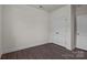 Clean bedroom showing two closets, wood look floors, and bright white walls at 657 District Ct, Fort Mill, SC 29708
