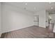 Open-concept living room with hardwood floors, neutral walls, and a staircase leading to the upper level at 657 District Ct, Fort Mill, SC 29708