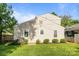 This home has a spacious yard with green grass and trimmed hedges at 700 Oakland Ave, Charlotte, NC 28204