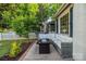 Backyard patio with comfortable seating and gas fire pit at 700 Oakland Ave, Charlotte, NC 28204