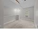 Bedroom with vaulted ceilings, updated lighting, and carpet flooring at 700 Oakland Ave, Charlotte, NC 28204