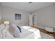 Comfortable bedroom with hardwood floors and great natural light and white accent rug at 700 Oakland Ave, Charlotte, NC 28204