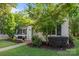 Charming home with manicured lawn, patio, and mature trees at 700 Oakland Ave, Charlotte, NC 28204