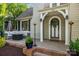 Charming front porch with brick steps, outdoor seating, and decorative door at 700 Oakland Ave, Charlotte, NC 28204