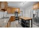 Traditional kitchen with wood cabinets, granite countertops, stainless steel appliances, and center island at 700 Oakland Ave, Charlotte, NC 28204