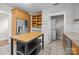 Bright kitchen featuring stainless steel refrigerator, butcher block island, and open shelving at 700 Oakland Ave, Charlotte, NC 28204
