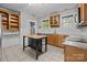 Traditional kitchen with wood cabinets, granite countertops, stainless steel appliances, and center island at 700 Oakland Ave, Charlotte, NC 28204
