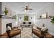 Inviting living room with fireplace, hardwood floors, and ample natural light at 700 Oakland Ave, Charlotte, NC 28204