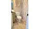 Small bathroom featuring a toilet, vanity with storage, tile floors, and a shower with decorative shower curtain at 788 N Main St, Mount Pleasant, NC 28124
