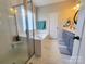 Bright bathroom featuring a soaking tub, a walk-in shower, and double sink vanity with elegant fixtures at 788 N Main St, Mount Pleasant, NC 28124