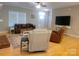 Inviting living room with hardwood floors, plush seating, a brick fireplace and lots of natural light at 788 N Main St, Mount Pleasant, NC 28124