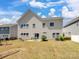 Spacious backyard featuring a patio with seating and a play set, perfect for outdoor relaxation and entertainment at 79411 Ridgehaven Rd, Indian Land, SC 29720