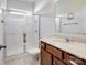 Bathroom featuring a shower with glass doors and a single sink vanity with a neutral color countertop at 79411 Ridgehaven Rd, Indian Land, SC 29720