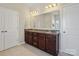 Bathroom featuring a double vanity with granite counters, offering ample space and modern amenities at 79411 Ridgehaven Rd, Indian Land, SC 29720