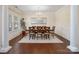 Formal dining room featuring hardwood floors, wainscoting, and a large mirror at 79411 Ridgehaven Rd, Indian Land, SC 29720