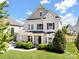 Charming two-story home with landscaped yard, covered porch, and attached two car garage at 79411 Ridgehaven Rd, Indian Land, SC 29720