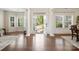 Elegant foyer with hardwood floors, white columns, and an open view to the outdoors at 79411 Ridgehaven Rd, Indian Land, SC 29720